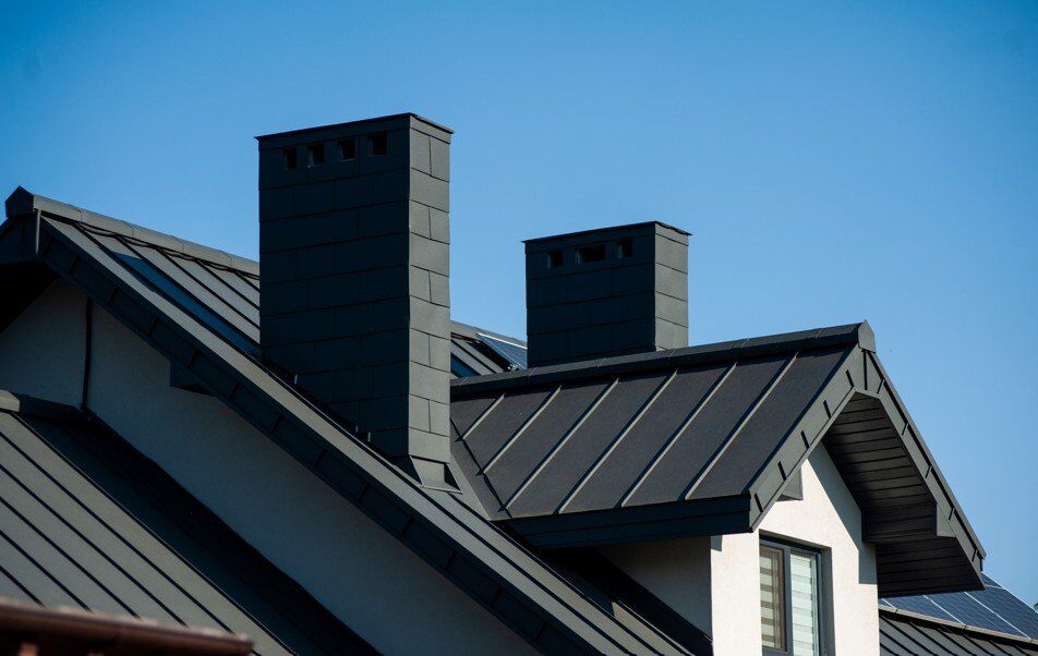 Standing seam metal roofing installation on residential home